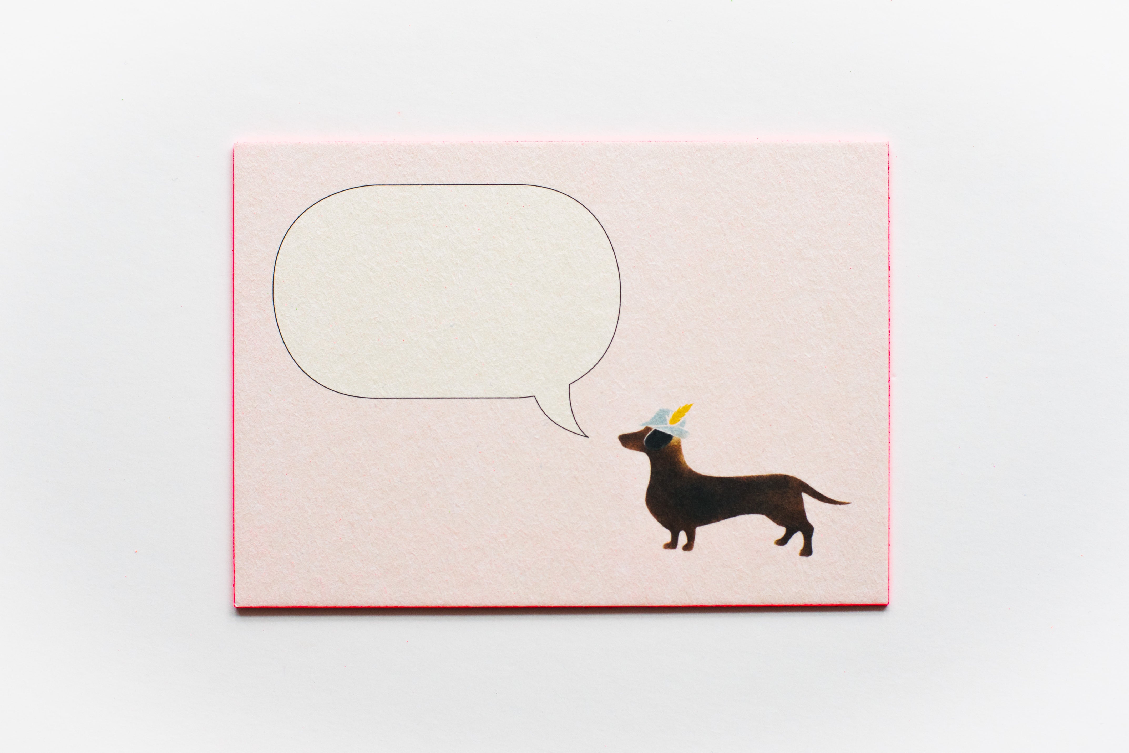 DACKEL MIT JÄGERHUT UND SPRECHBLASE